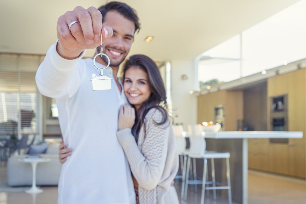 couple holding new home keys