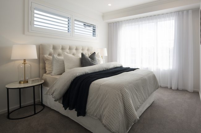 Whitehaven 238 bedroom with white curtains