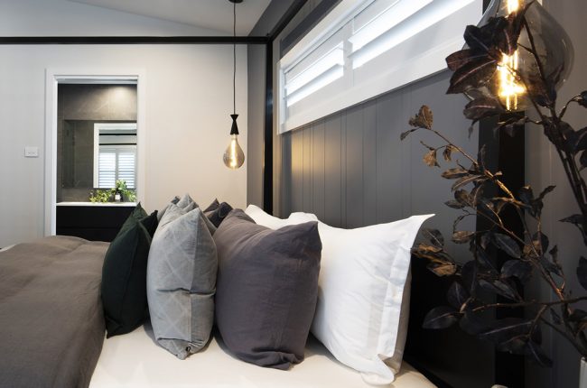 Monochrome bedroom design with pendant lights