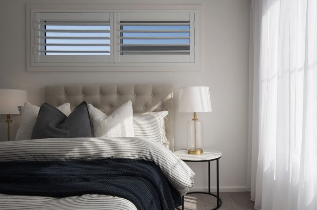 Whitehaven 238 bedroom with large windows and white curtains