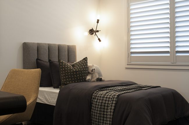 Cayman 287 kids bedroom with piles of pillows and blankets