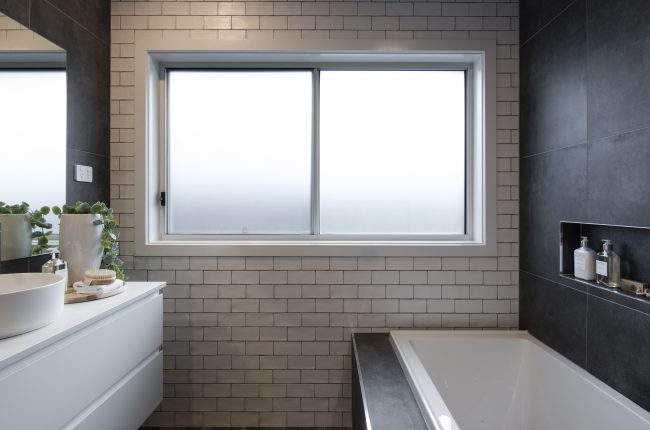 Avalon 2 220 bathroom with textured brick wall feature