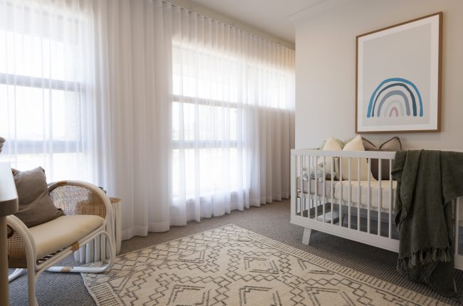 Bondi 249 nursery with white curtains and blankets