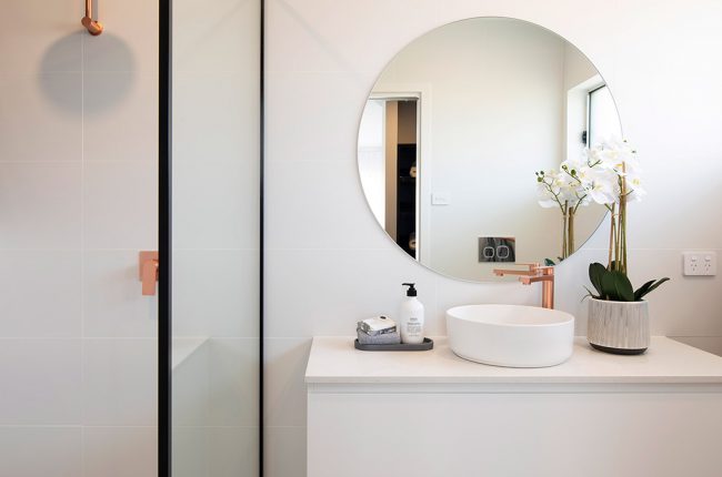 Riviera 1 267 minimalist bathroom with round mirror