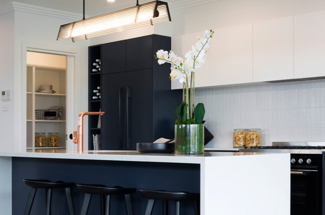Navy blue and white coloured kitchen