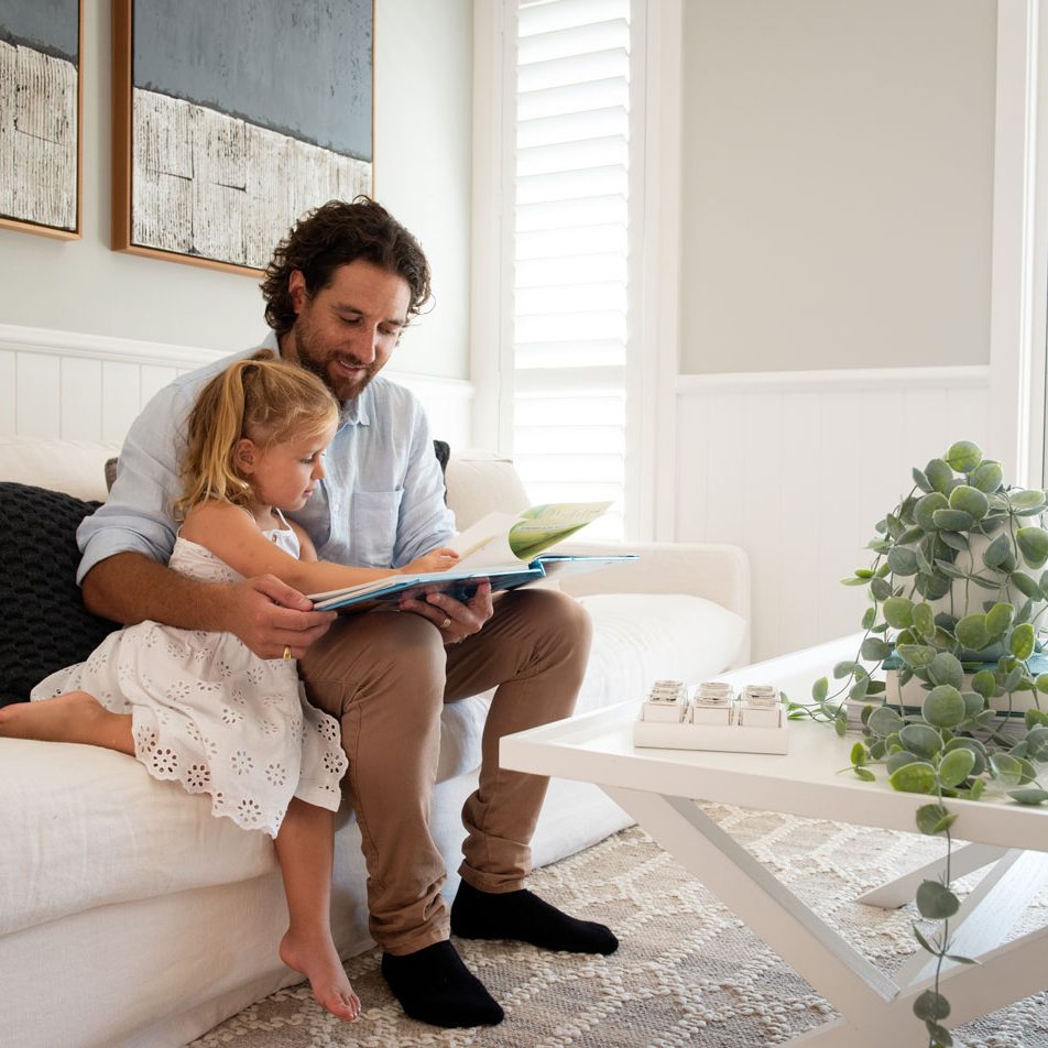 Montgomery-Homes-Difference Father and daughter reading